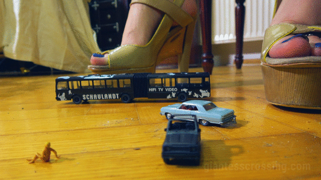 Loryelle comes home and finds some tiny people and cars in her living-room.
She decides to have her tea time with them, in her very own playful way. (Will anybody survive this?)
She crushes them with her high-heeled sandals and bare feet. She toys with them and some get devoured, too.
This clip also contains a lot of audio effects like booming steps, screaming people and several crash sounds.
Also enjoy very good close-up shots of Loryelles (dirty) beautiful feet.
