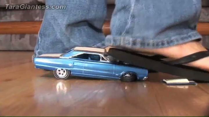 <p>Tara Crushes Blue Car in her sandals. This is a very cool Car crush video to open the site with. an absolute must for all car crush fans.</p>